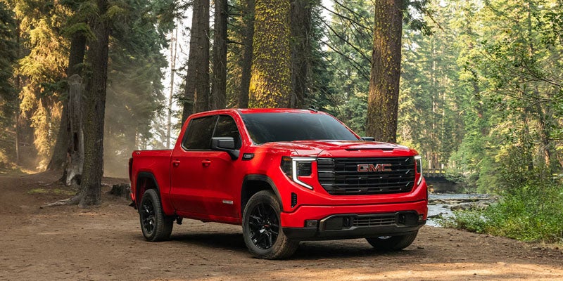 2026 GMC Sierra 1500 red truck off-road driving